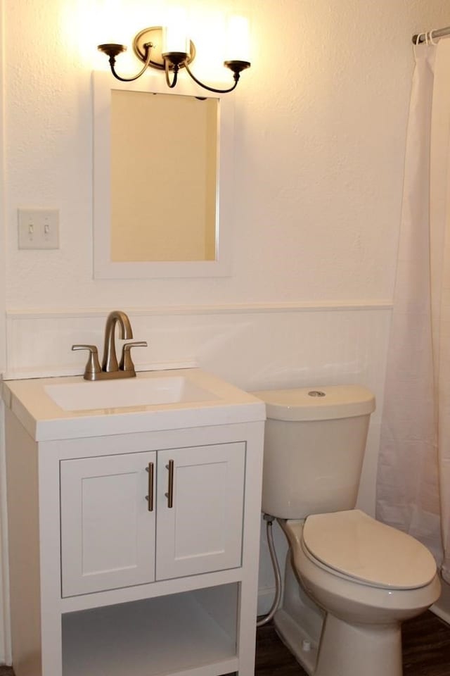 bathroom with vanity and toilet