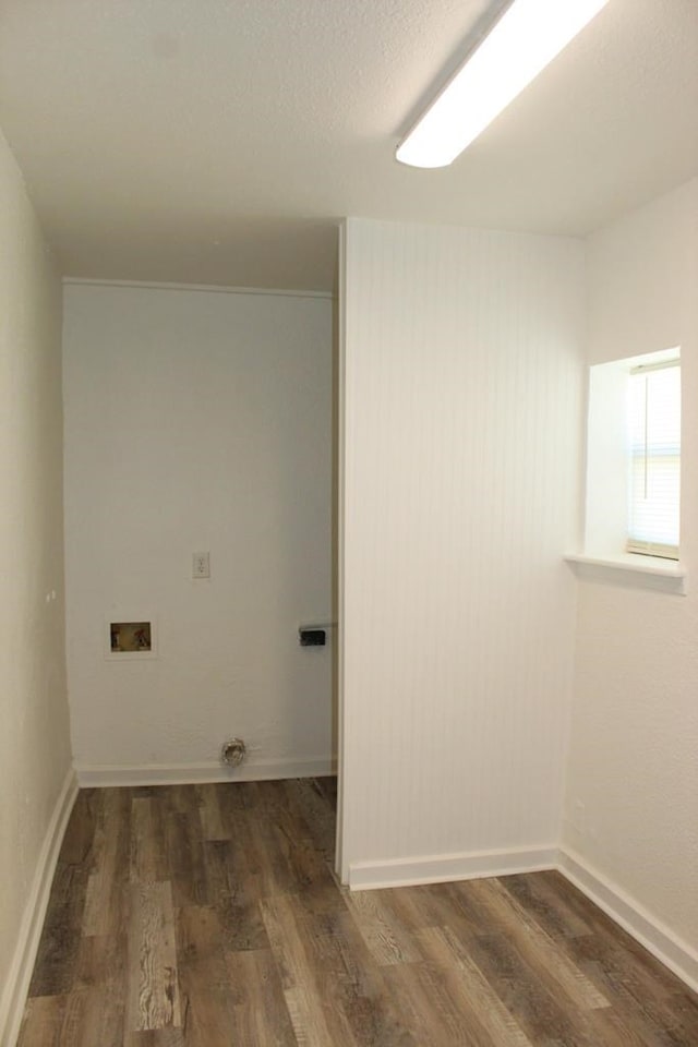 laundry area with dark wood-type flooring and hookup for a washing machine