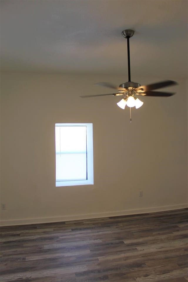 empty room featuring ceiling fan and dark hardwood / wood-style floors