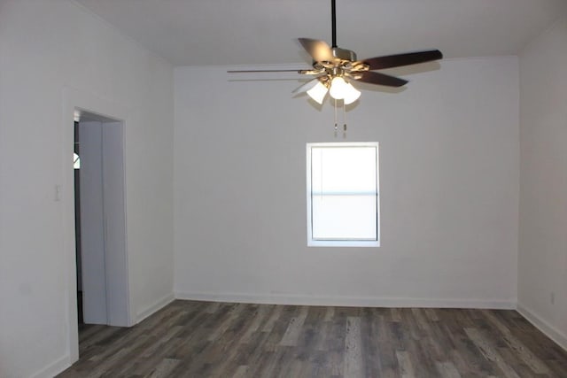 unfurnished room with ceiling fan and dark hardwood / wood-style floors