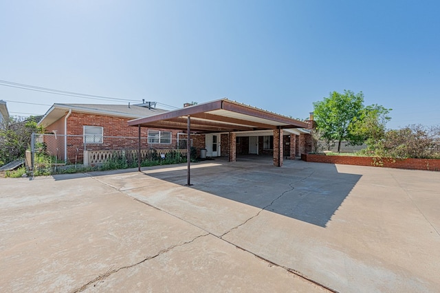 back of house with a carport