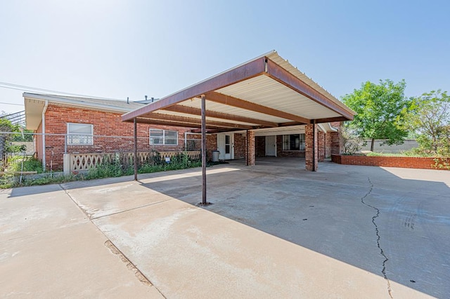 back of property featuring a carport