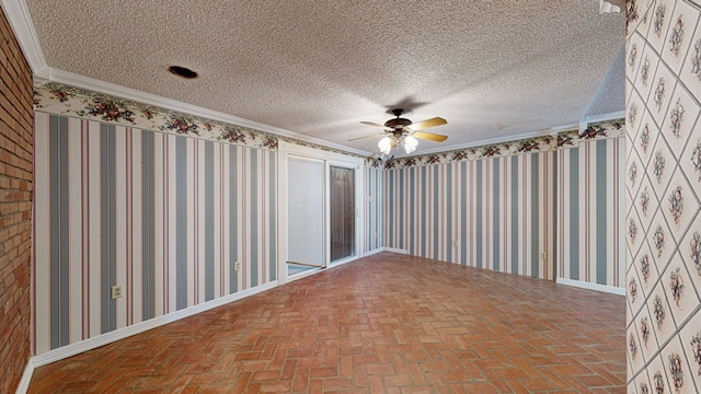 empty room featuring ceiling fan, crown molding, and a textured ceiling