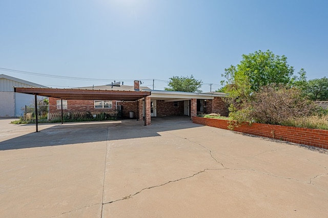 view of front of home featuring a carport