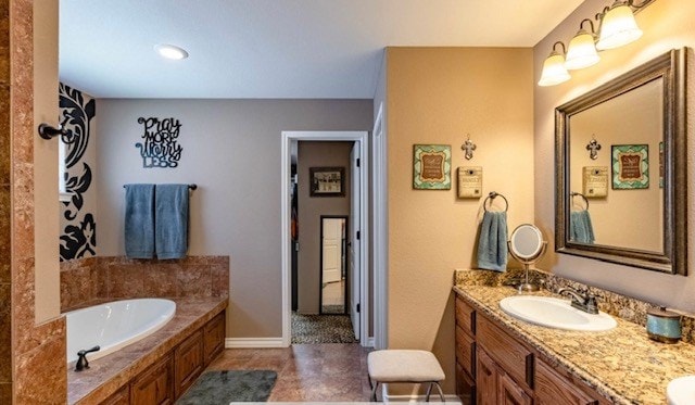 3113 San Pedro Dr, Odessa, TX 79765 - full bath featuring a garden tub, double vanity, and baseboards
