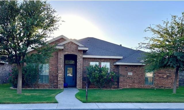 3113 San Pedro Dr, Odessa, TX 79765 - view of front of house with brick siding and a front lawn