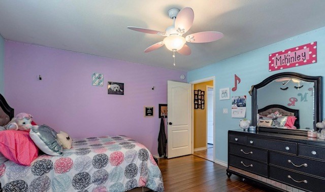 3113 San Pedro Dr, Odessa, TX 79765 - bedroom featuring dark wood-style flooring and ceiling fan