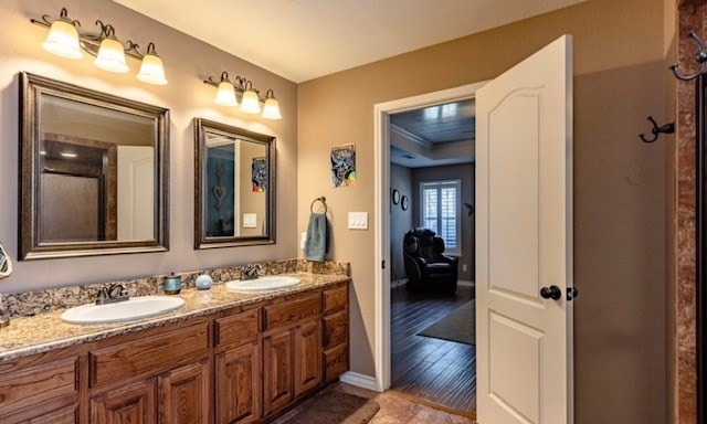 3113 San Pedro Dr, Odessa, TX 79765 - bathroom featuring double vanity and baseboards
