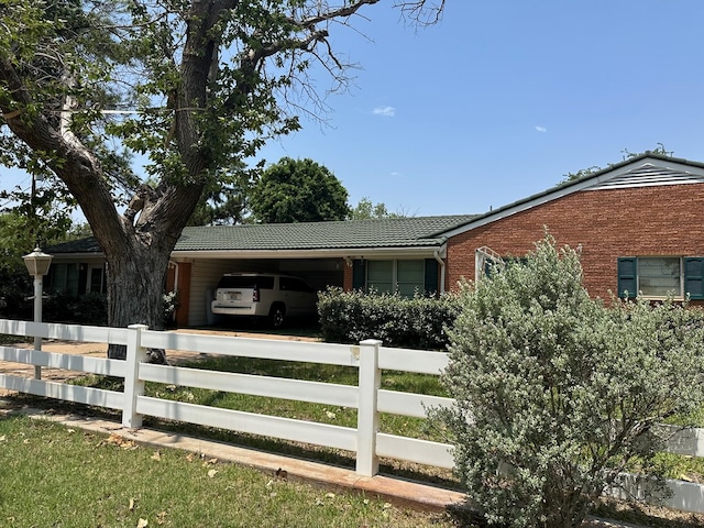 view of front facade with a carport