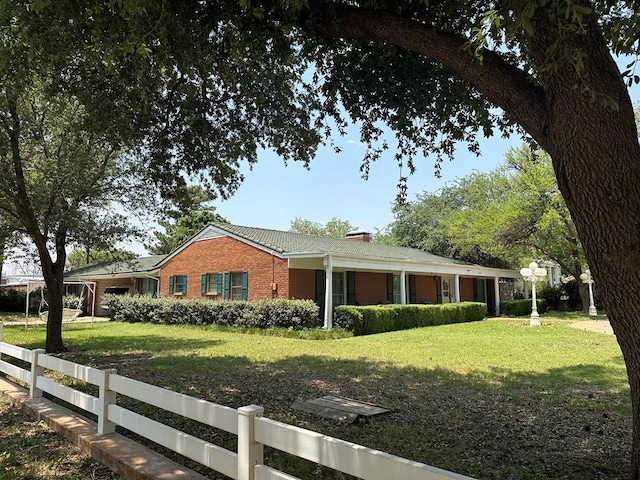 view of side of home featuring a yard