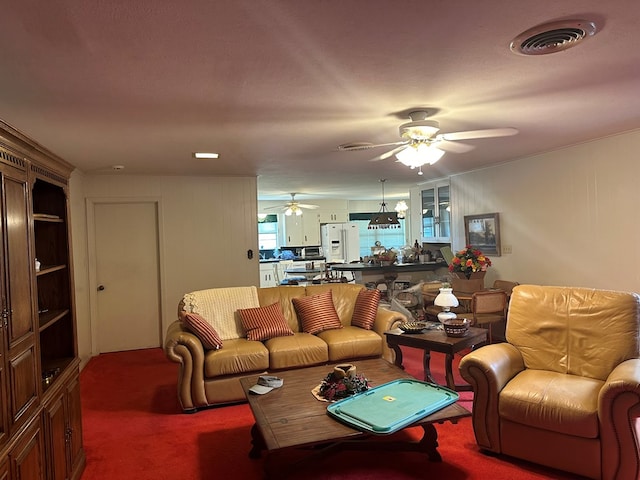 living room with carpet and a textured ceiling