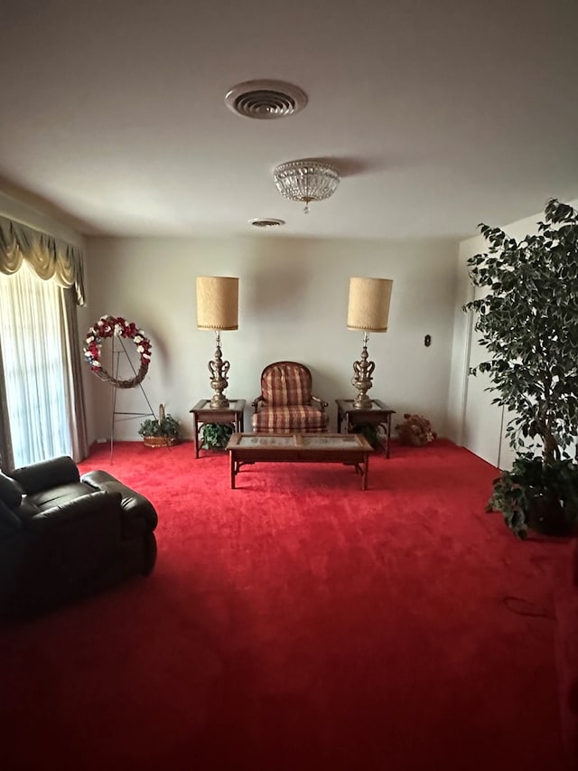 sitting room with carpet floors