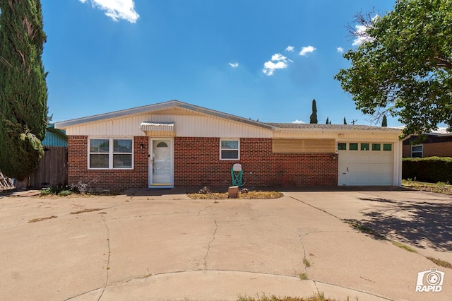 404 E Dormard Ave, Midland, TX 79705 - single story home with concrete driveway, brick siding, and an attached garage
