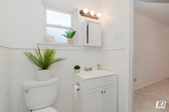 404 E Dormard Ave, Midland, TX 79705 - bathroom with vanity, wainscoting, and toilet