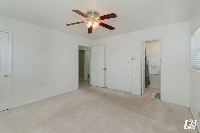 404 E Dormard Ave, Midland, TX 79705 - unfurnished bedroom with carpet floors, baseboards, ensuite bathroom, and ceiling fan