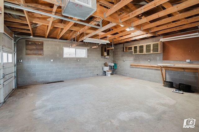 404 E Dormard Ave, Midland, TX 79705 - below grade area featuring a garage, a healthy amount of sunlight, and concrete block wall