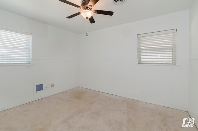 404 E Dormard Ave, Midland, TX 79705 - empty room with plenty of natural light, ceiling fan, and carpet floors