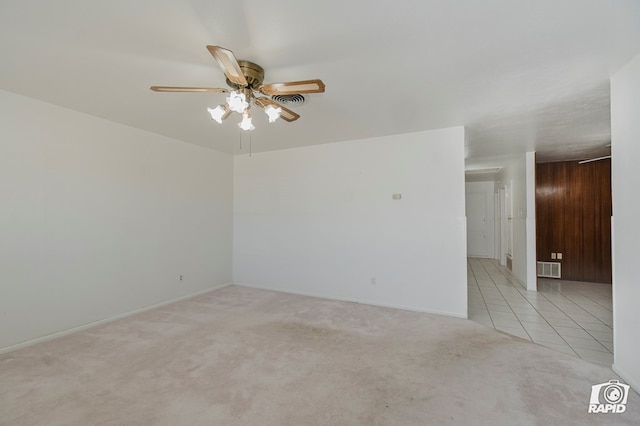 404 E Dormard Ave, Midland, TX 79705 - tiled empty room with carpet floors, baseboards, a ceiling fan, and visible vents