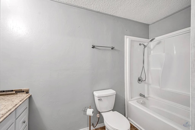 full bathroom with vanity,  shower combination, toilet, and a textured ceiling