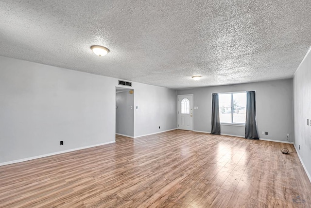 empty room featuring light hardwood / wood-style floors