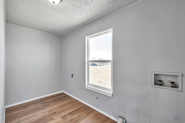 interior space featuring hardwood / wood-style floors and a textured ceiling