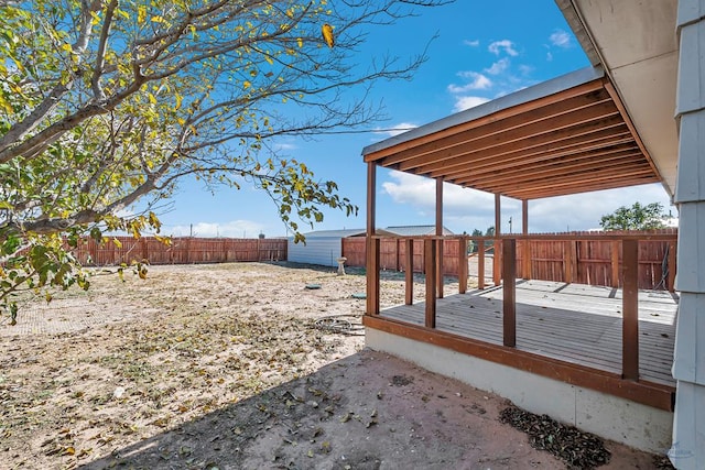 view of yard featuring a wooden deck