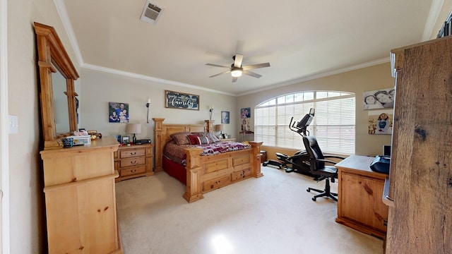 bedroom featuring an office area, crown molding, light carpet, and a ceiling fan
