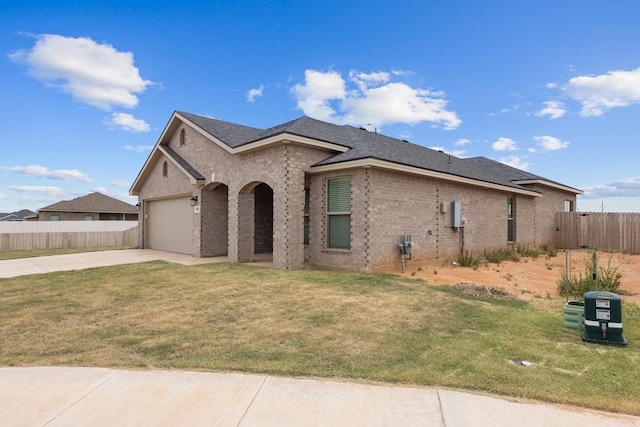 2602 Ivy Ln, Midland, TX 79705 - view of front of home featuring driveway, brick siding, and an attached garage