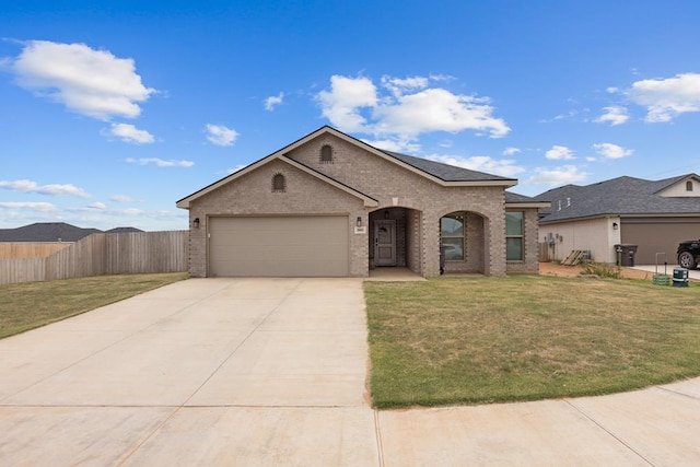 2602 Ivy Ln, Midland, TX 79705 - view of front of property with brick siding, a garage, and driveway