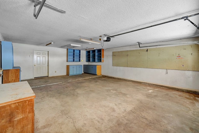 4205 Irvin Dr, Midland, TX 79705 - garage featuring a garage door opener and baseboards