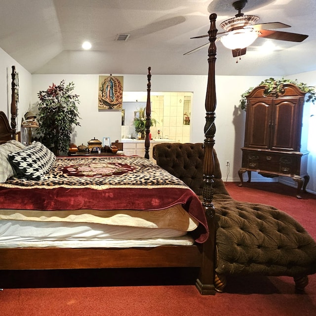 bedroom featuring carpet, visible vents, vaulted ceiling, and ceiling fan