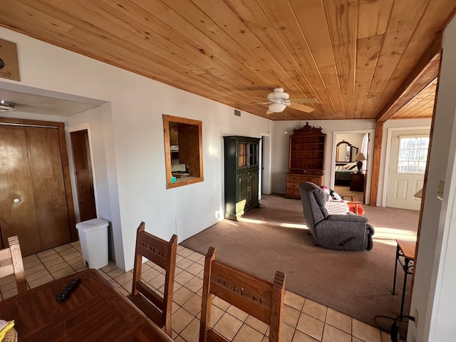 interior space with ceiling fan and wooden ceiling