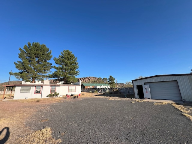 view of front of home featuring an outbuilding and a garage