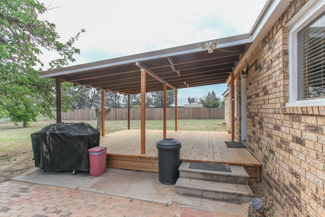 view of patio / terrace with a fenced backyard, a deck, and area for grilling