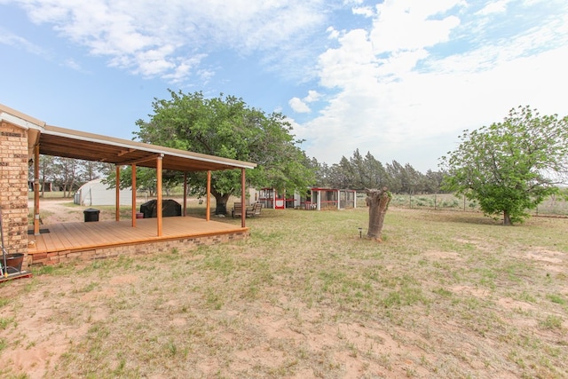 view of yard with a deck
