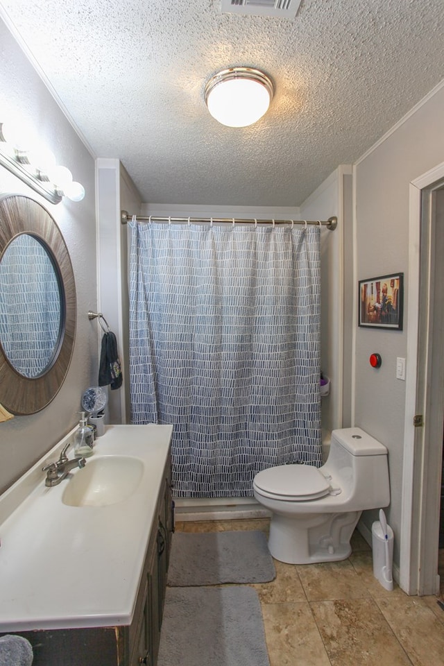 bathroom with vanity, visible vents, toilet, a textured ceiling, and a shower with curtain