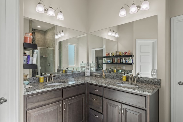 8421 E County Rd 115, Midland, TX 79706 - bathroom featuring a shower stall and double vanity