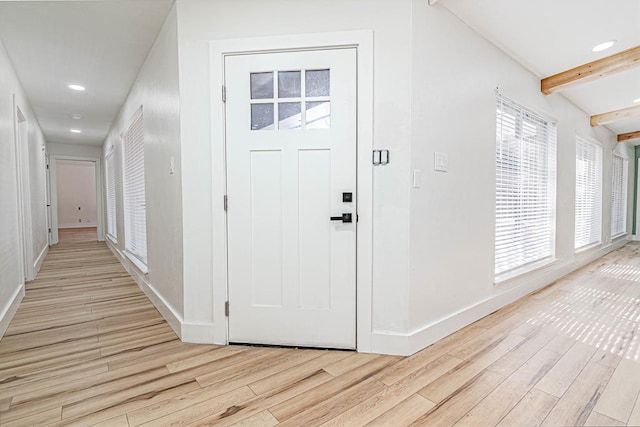 1017 Ward St, Midland, TX 79701 - foyer entrance featuring wood finished floors, beamed ceiling, baseboards, and recessed lighting