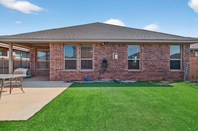 1307 Pavilion Pkwy, Midland, TX 79705 - rear view of property with brick siding, a shingled roof, and a patio area