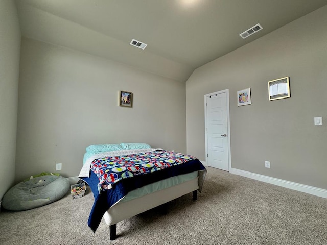 bedroom with visible vents, carpet flooring, baseboards, and vaulted ceiling