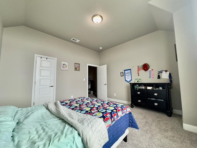 bedroom featuring light colored carpet, baseboards, vaulted ceiling, and visible vents