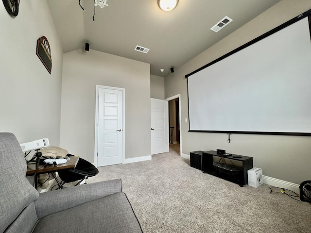 cinema with baseboards, carpet flooring, vaulted ceiling, and visible vents