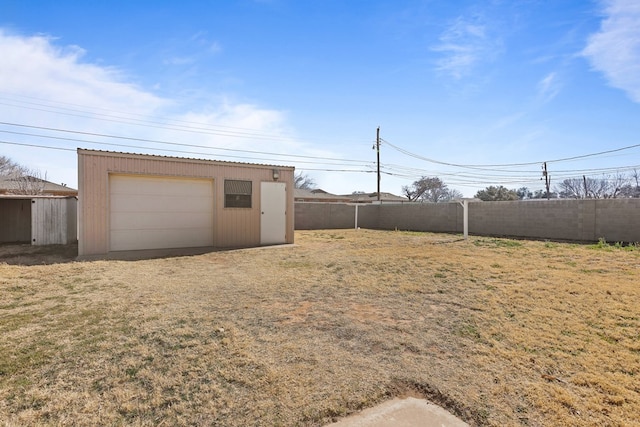 view of yard with a garage and an outdoor structure