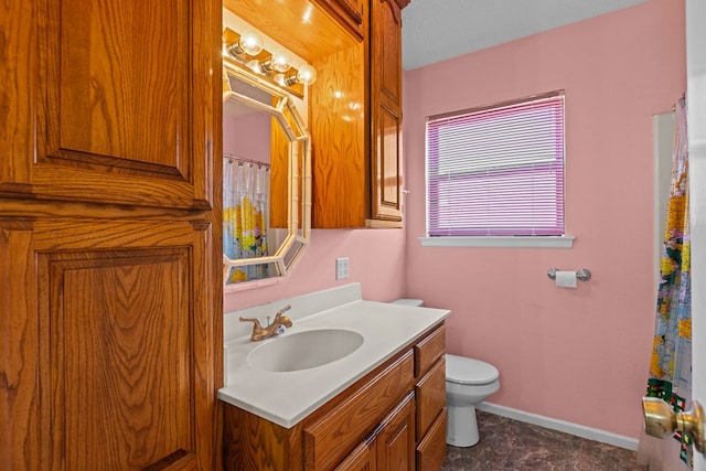 bathroom featuring vanity and toilet