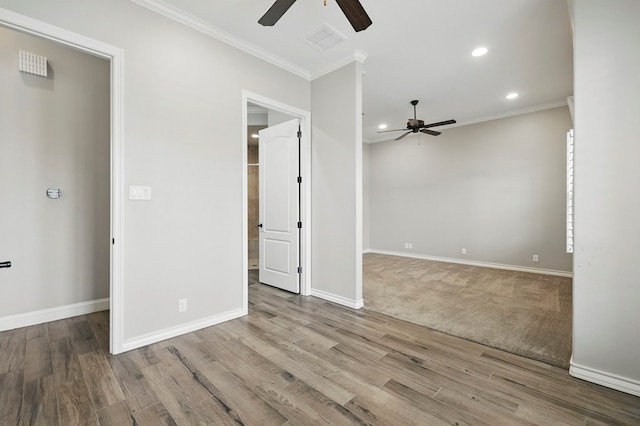 unfurnished room featuring ceiling fan, ornamental molding, recessed lighting, wood finished floors, and baseboards