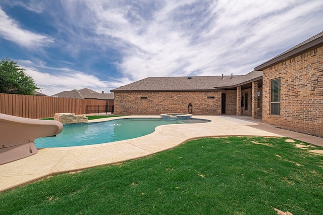 view of pool with a water slide, a patio, and a pool with connected hot tub