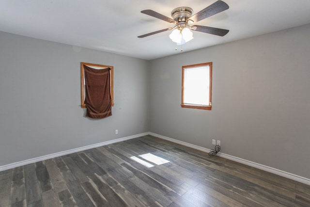 2004 State St, Big Spring, TX 79720 - empty room with dark wood-type flooring and a ceiling fan