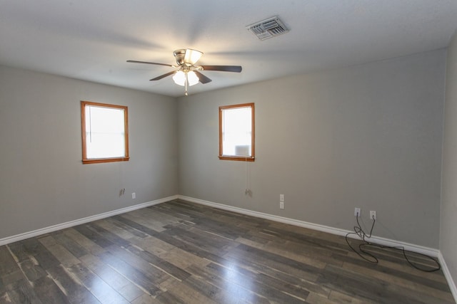 2004 State St, Big Spring, TX 79720 - empty room featuring healthy amount of natural light, ceiling fan, and dark wood-style floors
