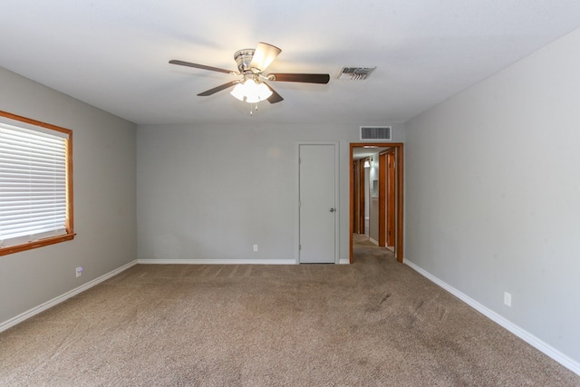 2004 State St, Big Spring, TX 79720 - spare room featuring carpet flooring and ceiling fan