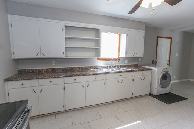 2004 State St, Big Spring, TX 79720 - kitchen featuring washer / clothes dryer, ceiling fan, dark countertops, and electric stove